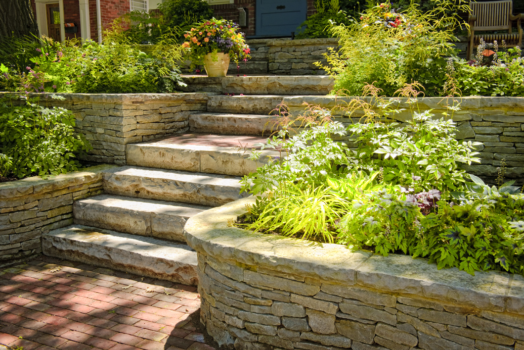Add curb appeal to your home with a new retaining wall or custom paved path!
